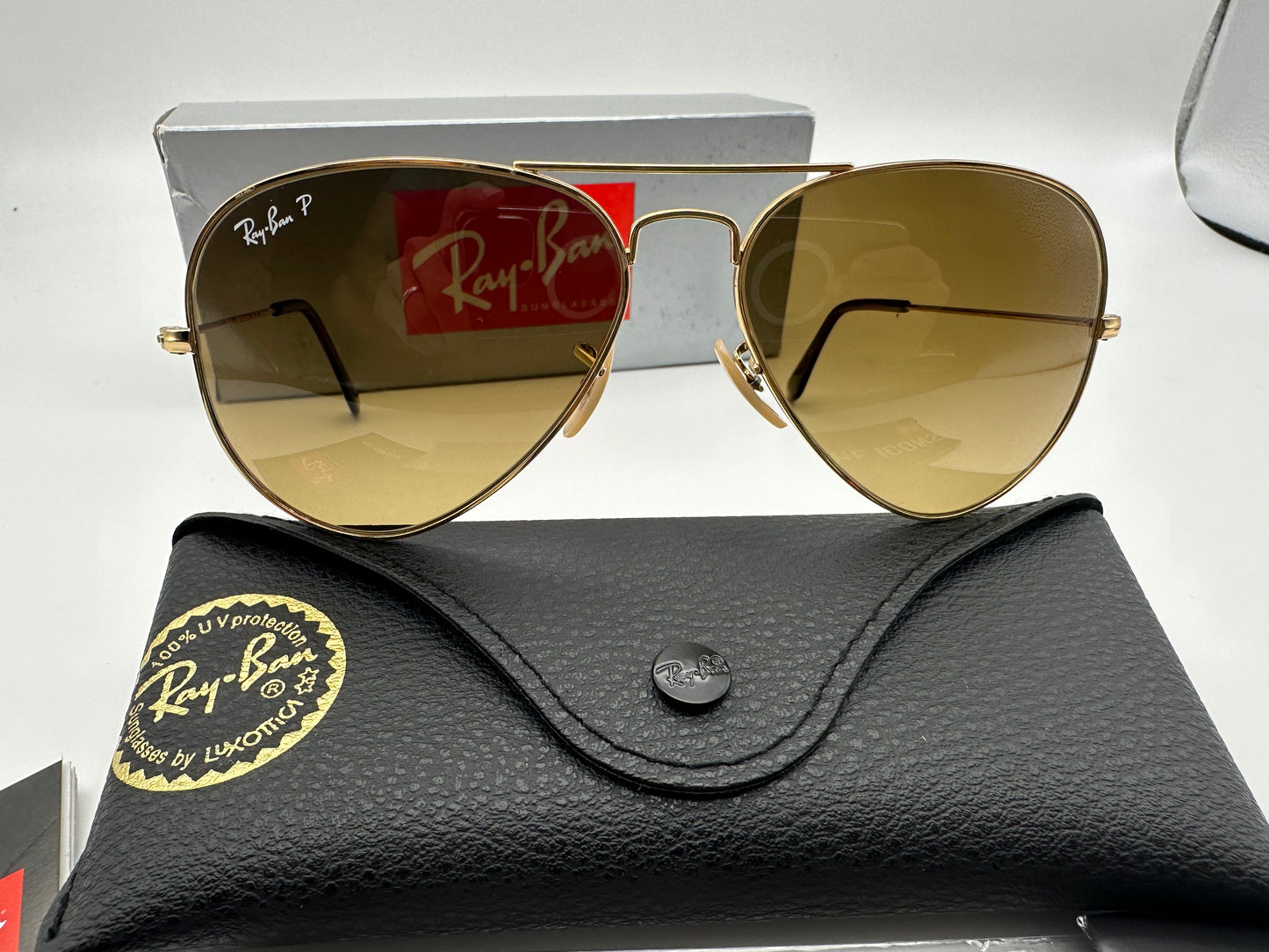Ray ban aviator gold brown 2024 gradient polarized